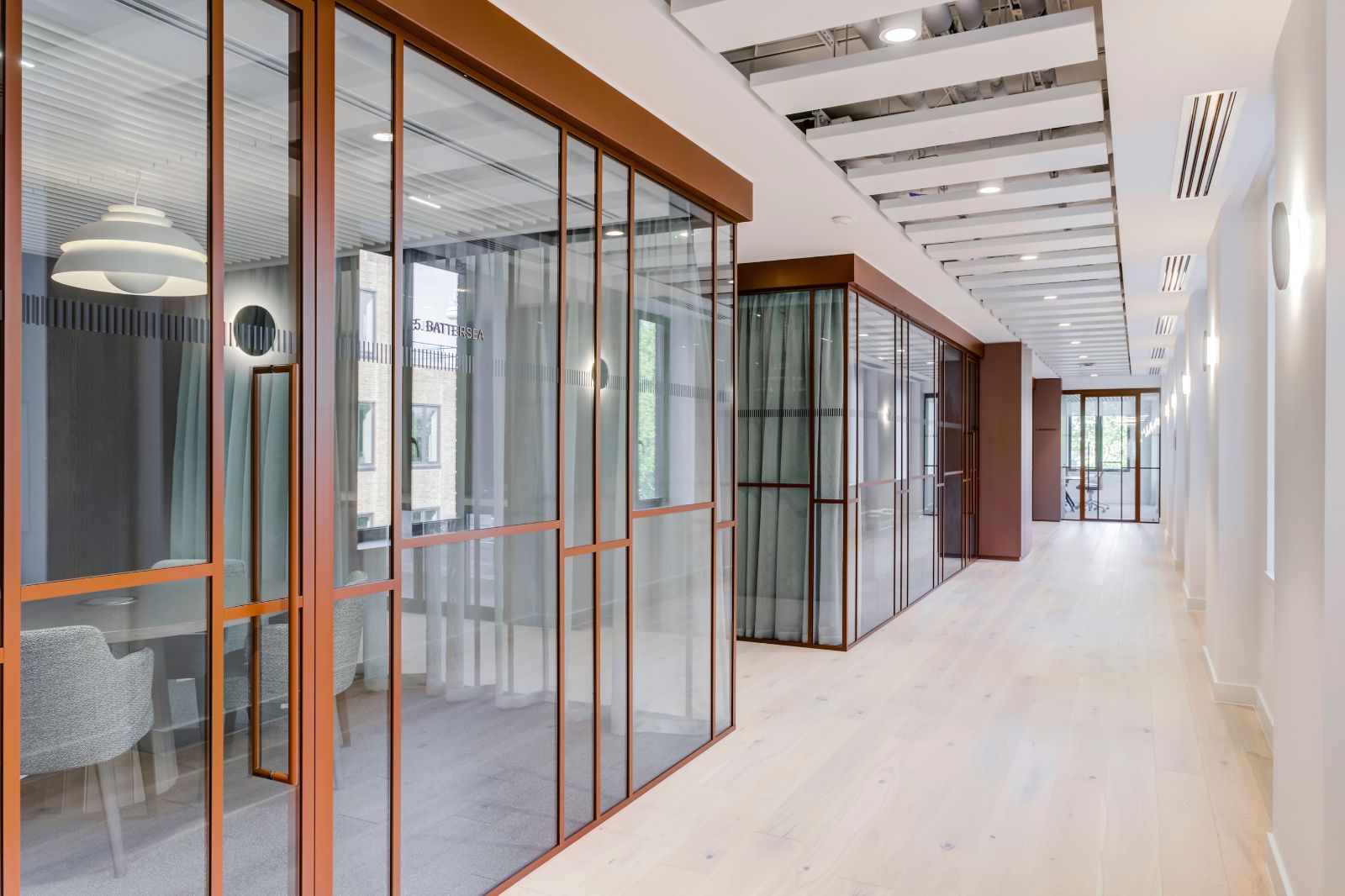 Concept25 slimline glazed partitioning within a contemporary workplace.